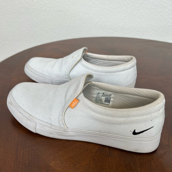 Nike White Slip-On Sneakers with Black Swoosh and Orange Tag - Picture 1 of 7